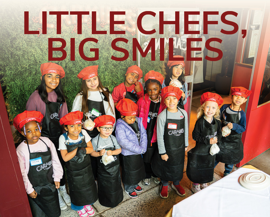 All of the kids from a pasta class posing for the class portrait.